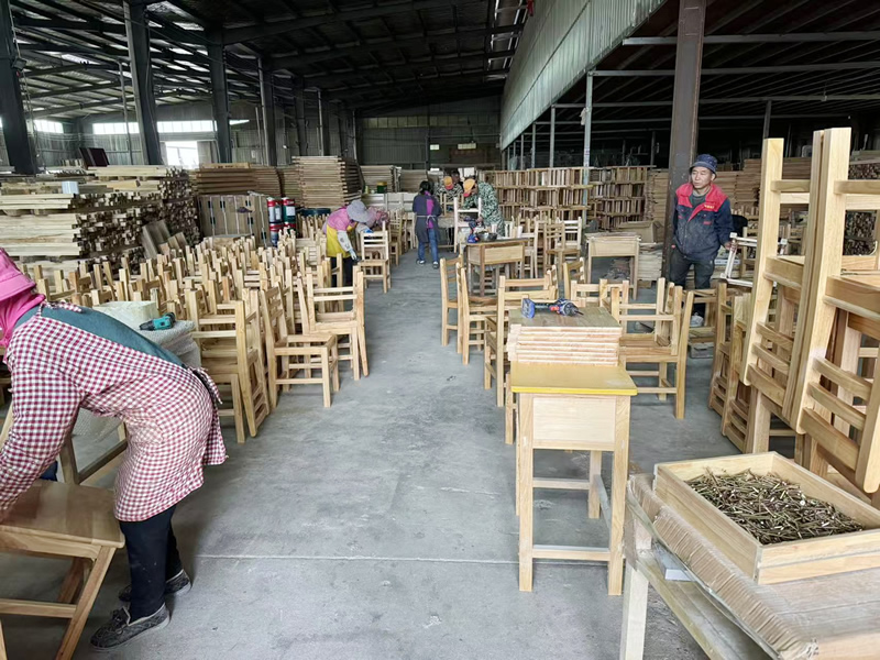 Wooden desks and chairs assembly workshop